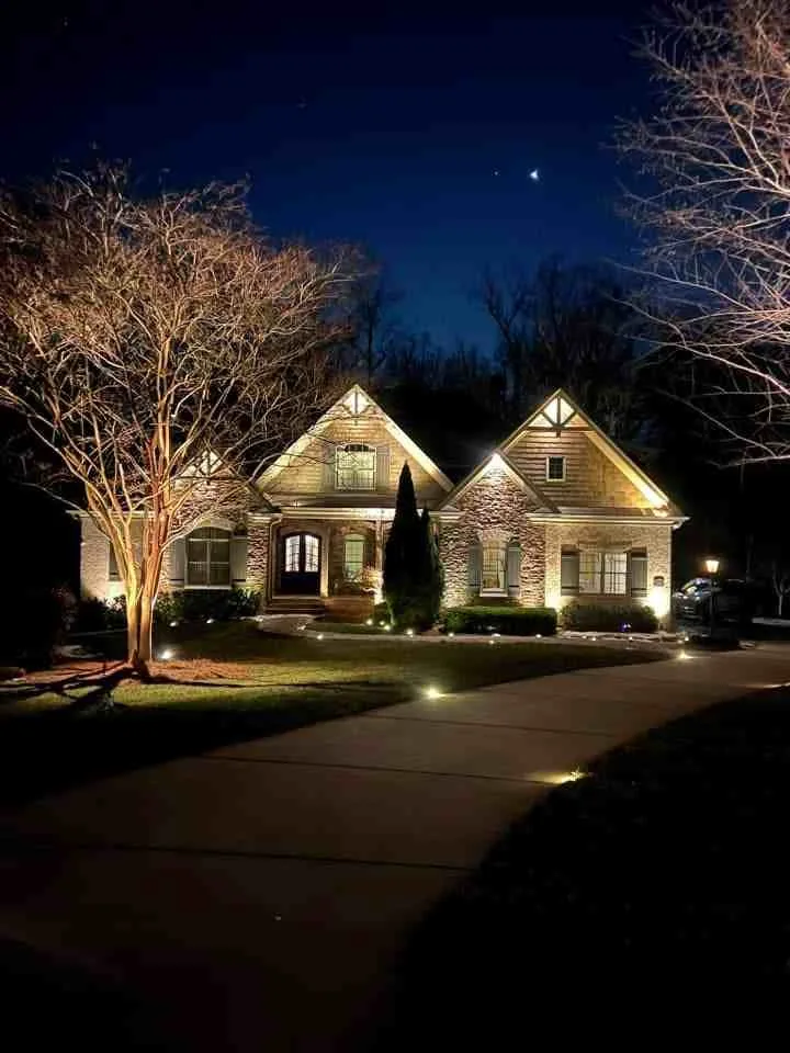 Home with architectural and landscape lighting